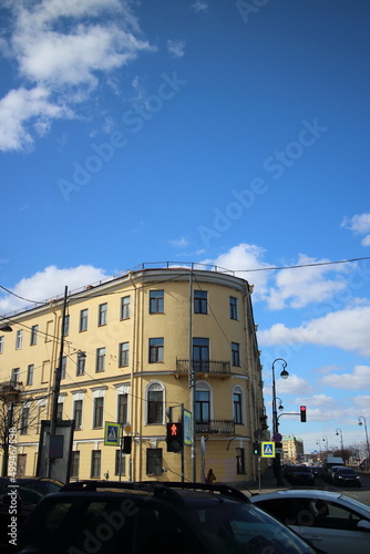 Old four-story yellow house in the city center © Andrey
