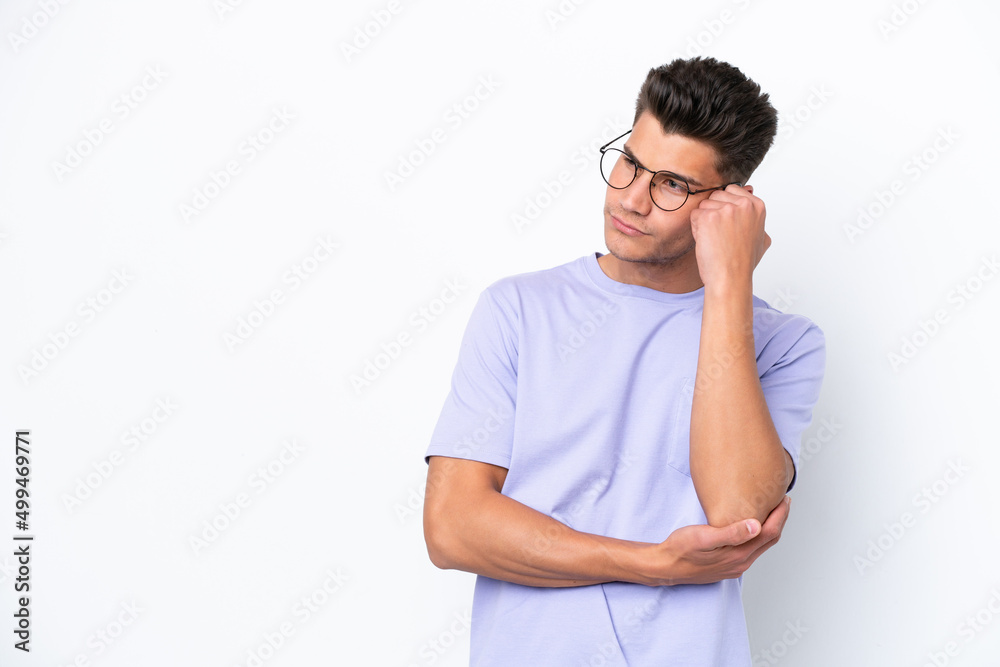 Young caucasian man isolated on white background with tired and bored expression Young caucasian man isolated on white background with tired and bored expression