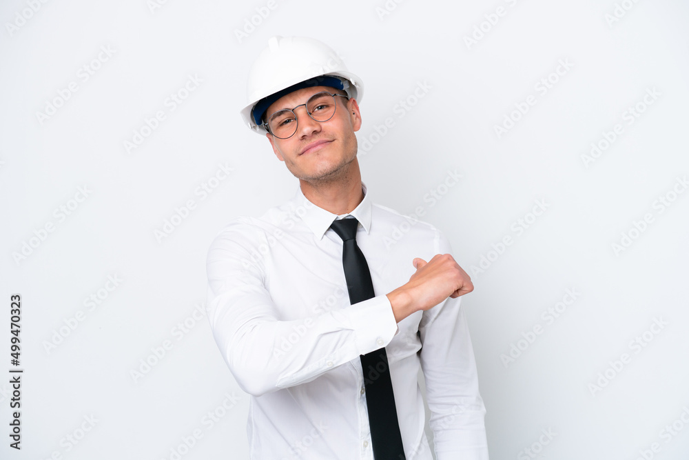 Young architect caucasian man with helmet and holding blueprints isolated on white background proud and self-satisfied Young architect caucasian man with helmet and holding blueprints isolated on white background proud and self-satisfied
