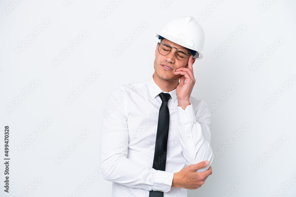 Young architect caucasian man with helmet and holding blueprints isolated on white background with headache Young architect caucasian man with helmet and holding blueprints isolated on white background with headache