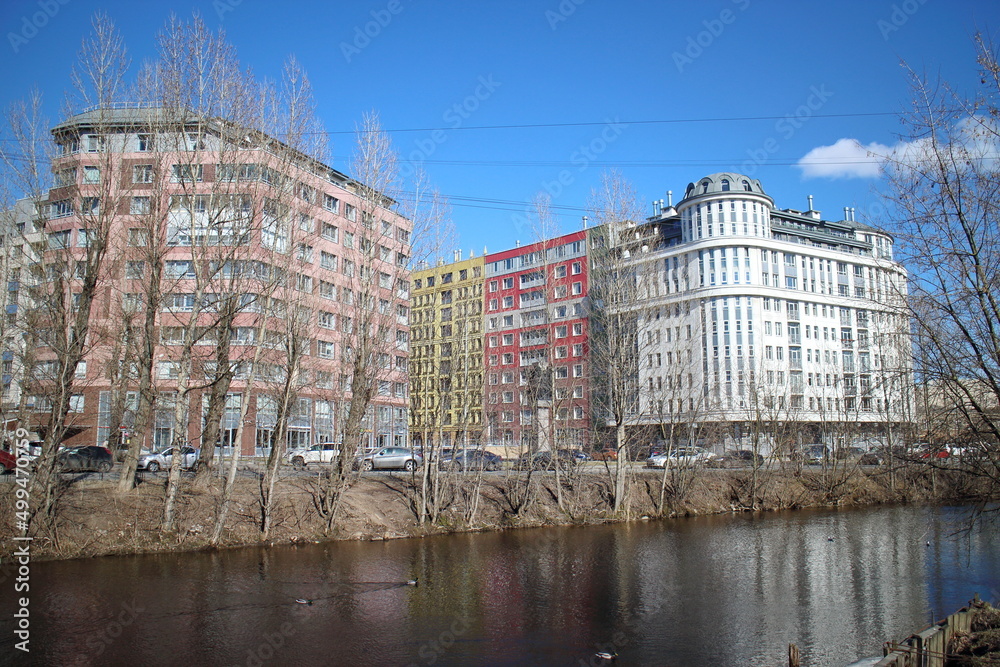 river with trees along the banks in the city center