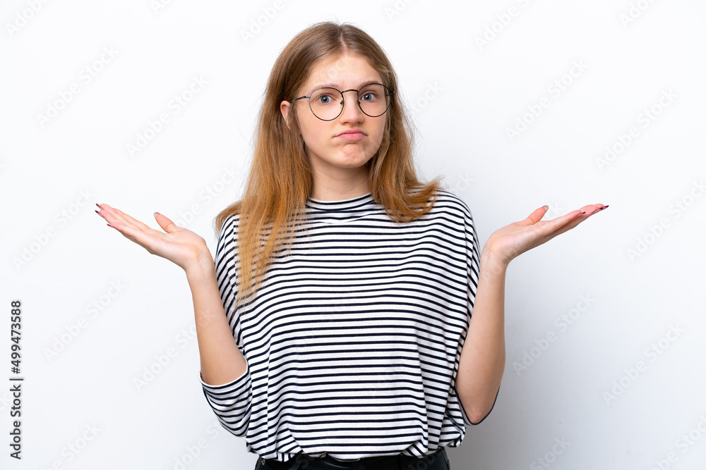 Teenager Russian girl isolated on white background making doubts gesture Teenager Russian girl isolated on white background making doubts gesture