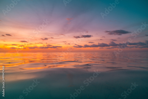 Sea sand sky concept, sunset colors clouds, horizon, amazing sunrise background. Ocean nature landscape, beautiful sunset colors, wonderful seascape. Tropical seaside. Sunny beach, summer skyscape