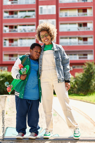 Wallpaper Mural African american mother with son preparing before skateboarding Torontodigital.ca