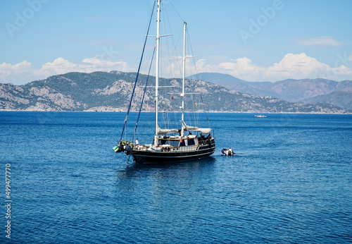 Luxury yachts or boats in the sea. View of the blu water, mountains in the background.  Travel concept © Anna