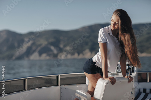 cute young woman on a luxury yacht © GTeam