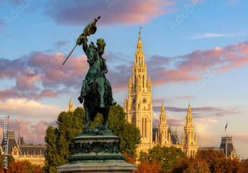Fotografiet Statue of archduke Charles with Vienna City hall at background, Austria