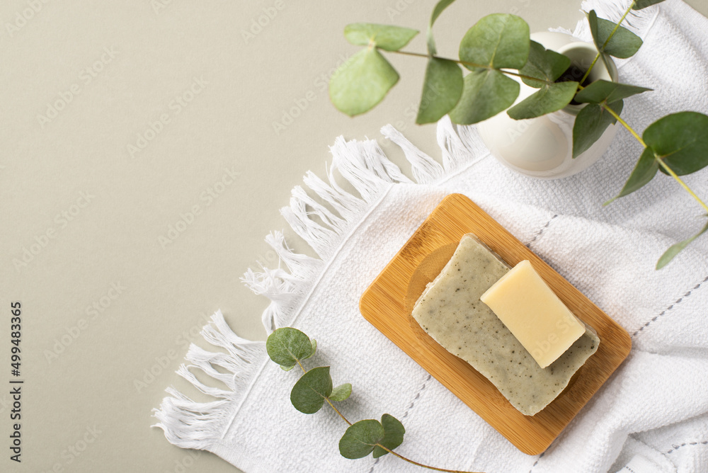 Top view photo of soap on wooden stand white towel and vase with eucalyptus on isolated pastel grey background with copyspace - obrazy, fototapety, plakaty 
