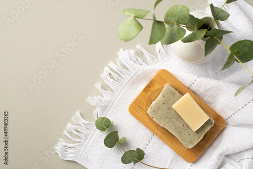Wallpaper Mural Top view photo of soap on wooden stand white towel and vase with eucalyptus on isolated pastel grey background with copyspace Torontodigital.ca