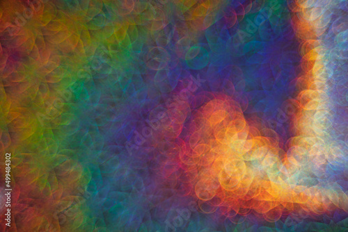 bright abstract iridescent background with bokeh holography