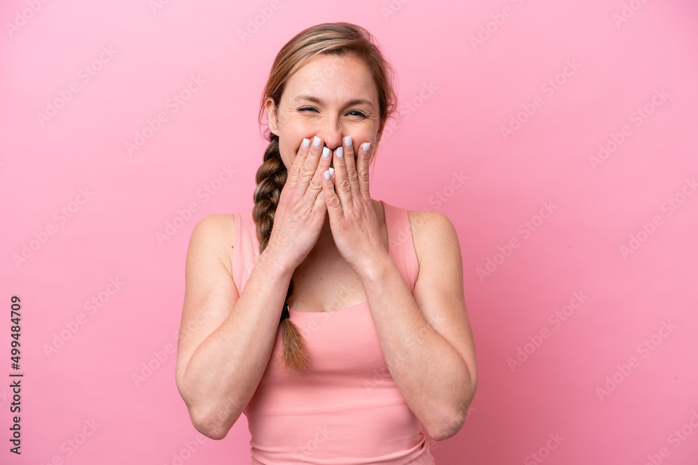 Young caucasian woman isolated on pink background happy and smiling covering mouth with hands Young caucasian woman isolated on pink background happy and smiling covering mouth with hands