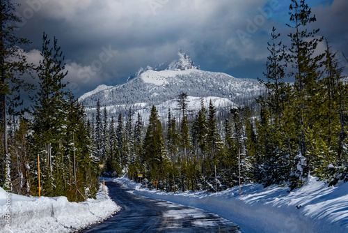 Snow covered Three Fingered Jack mountain and access road to Hoodoo ski area in the central Oregon cascade mountains