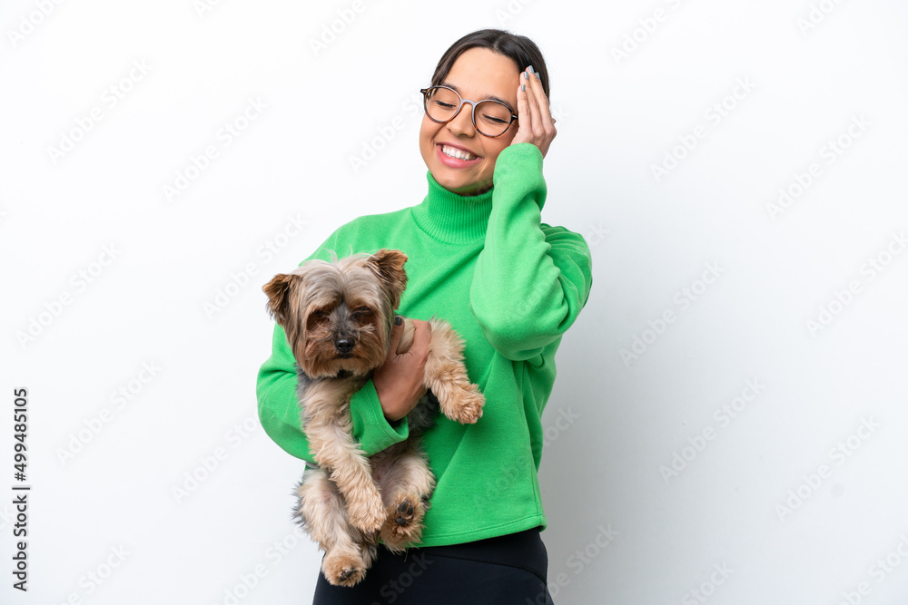 Young hispanic woman holding a dog isolated on white background has realized something and intending the solution Young hispanic woman holding a dog isolated on white background has realized something and intending the solution