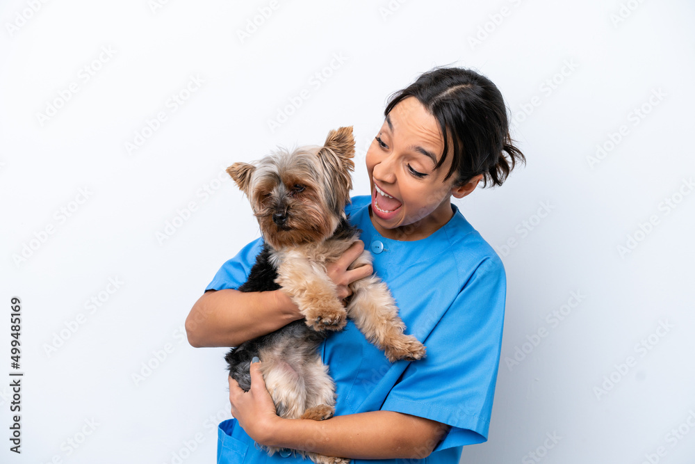 Young veterinarian woman with dog isolated on white background celebrating a victory Young veterinarian woman with dog isolated on white background celebrating a victory