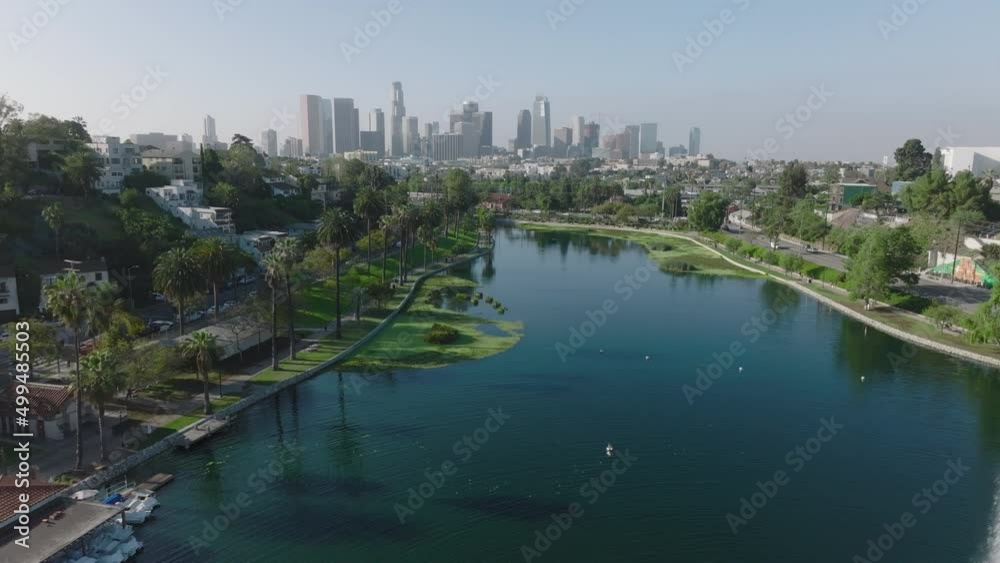 flying backwards over Echo Park Lake with downtown LA in background flying backwards over Echo Park Lake with downtown LA in background