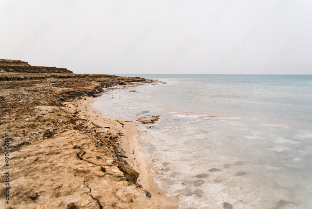 Landscape image of the Dead Sea in Israel during a cloudy day. 