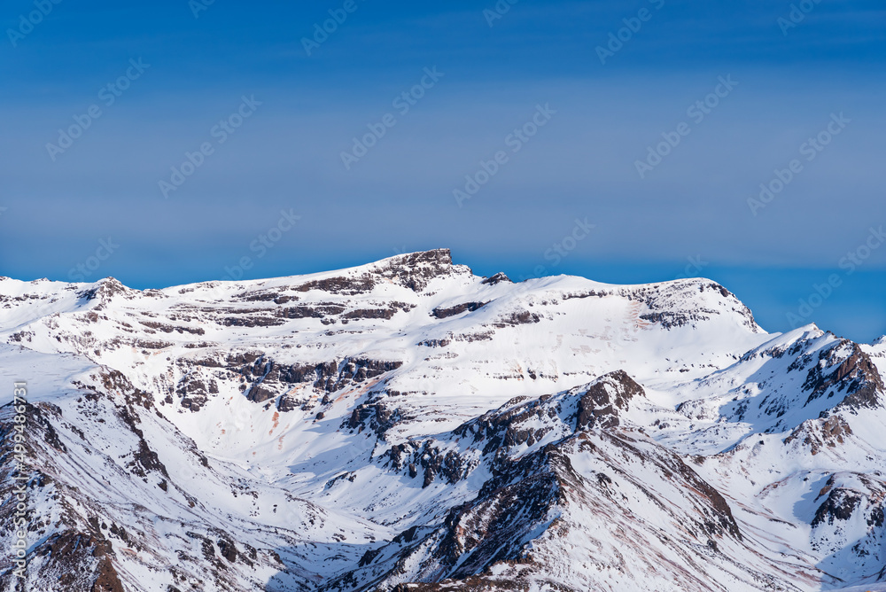 View from the south of the top of Veleta in Sierra Nevada, all covered by a blanket of snow.