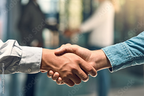 You have to give respect to get it. Shot of two unidentifiable young business partners shaking hands in the office.