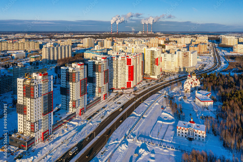 Surgut city in winter. Residential area, city development. Aerial view.