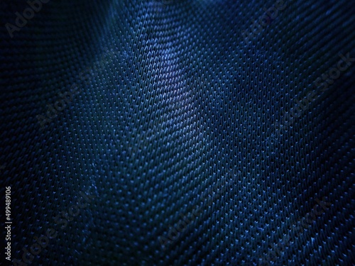 Abstract texture dark blue reflective background with dotted surface for design banner
