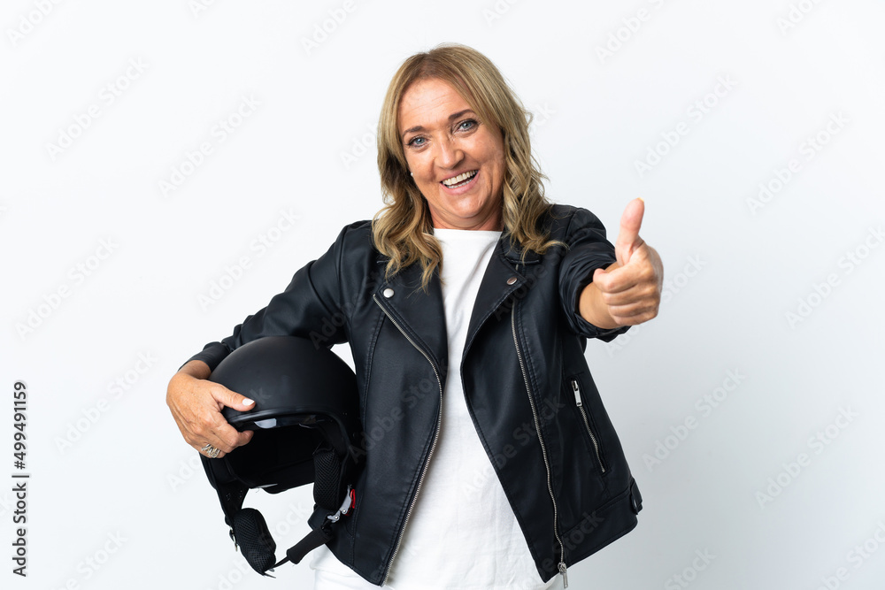 Middle aged biker over isolated white background with thumbs up because something good has happened Middle aged biker over isolated white background with thumbs up because something good has happened