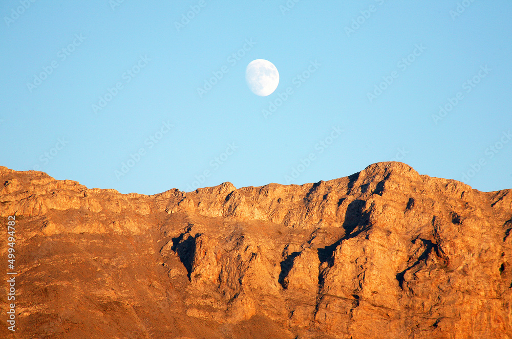 Mount Olympus mountain range and moon at sunset in Greece.