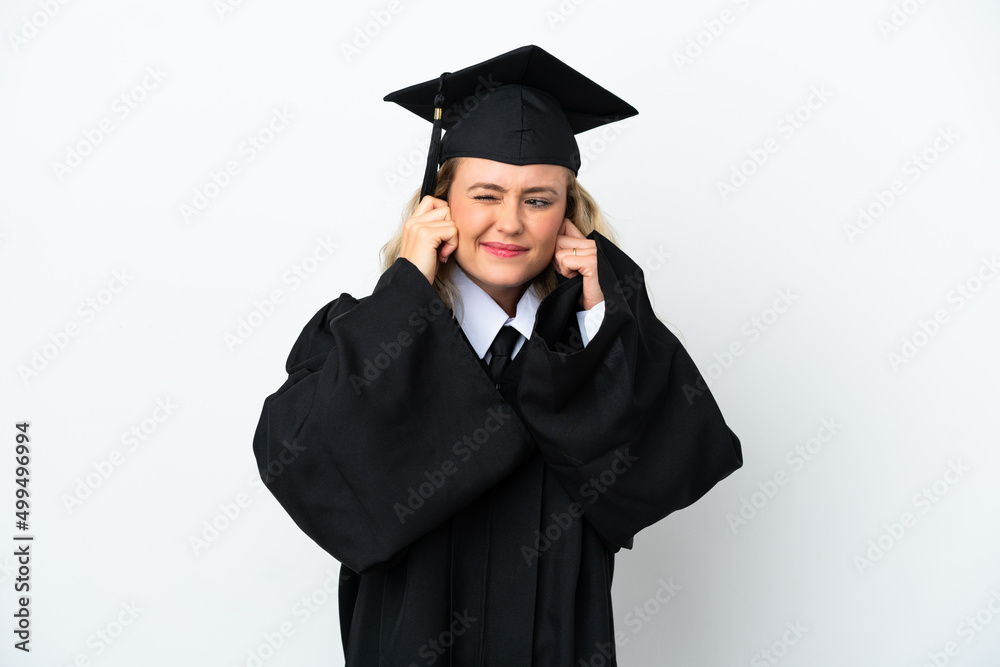 Young university graduate woman isolated on white background frustrated and covering ears