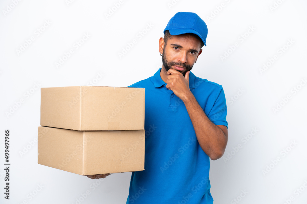 Delivery Brazilian man isolated on white background thinking Delivery Brazilian man isolated on white background thinking