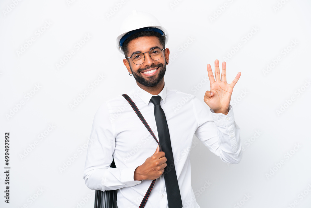 Young architect Brazilian man with helmet and holding blueprints isolated on white background happy and counting four with fingers Young architect Brazilian man with helmet and holding blueprints isolated on white background happy and counting four with fingers