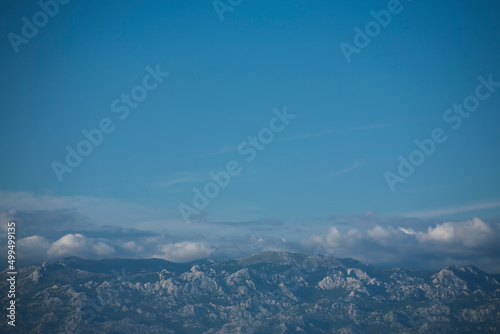 Blue skies and Velebit mountain peaks below