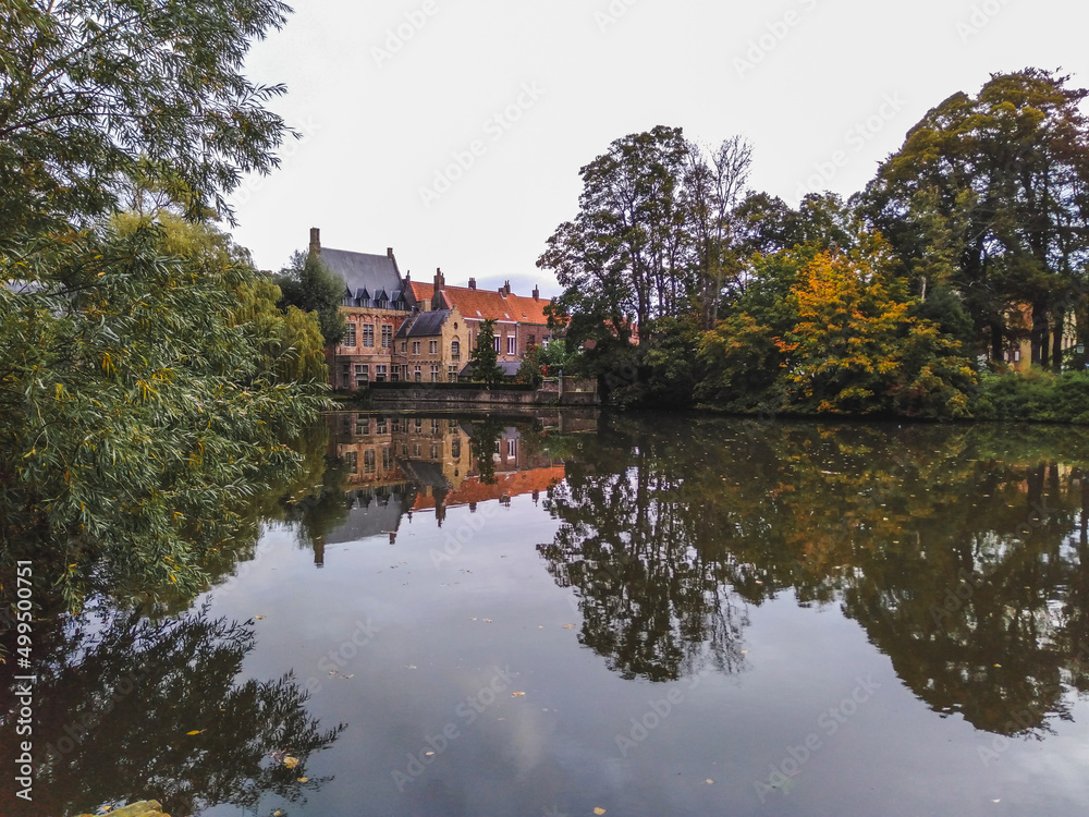 Bruges town reflected in Lake of Love, Belgium Bruges town reflected in Lake of Love, Belgium