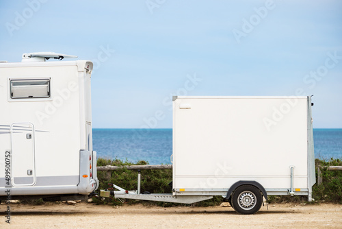 Caravan with trailer on beach