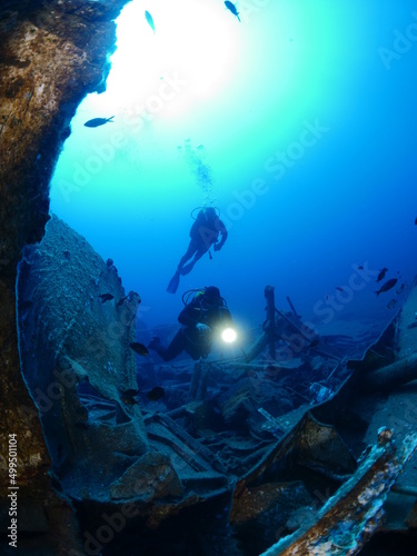  ship wreck underwater deep sea bottom metal on ocean floor scuba divers to explore