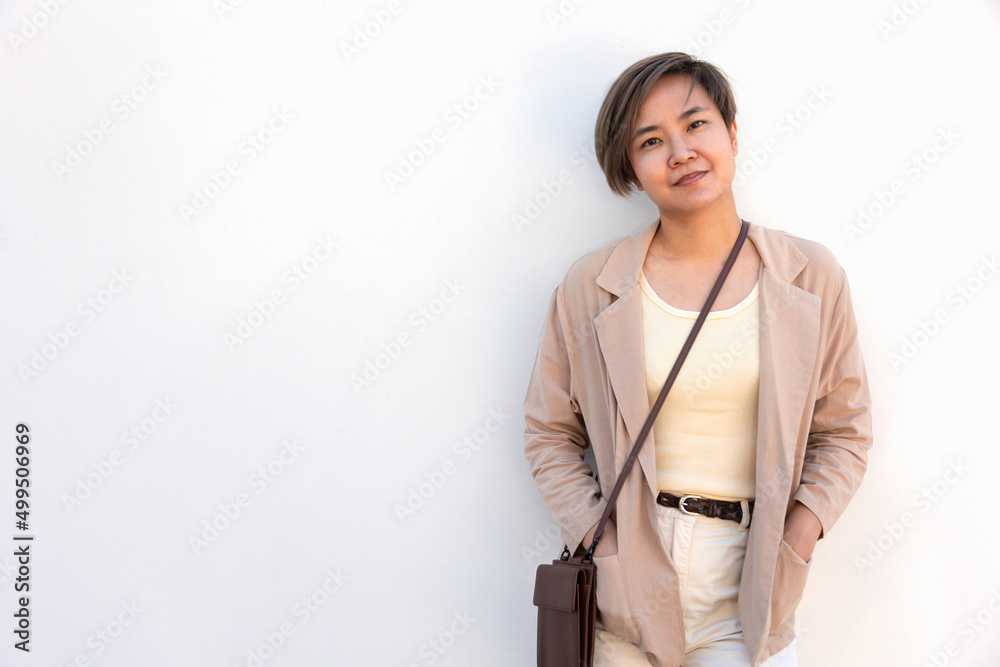 White background Portrait of beautiful and young asian woman with confident smile and posture shows concept of smart, attractive and positive business female with casual dress in modern lifestyle.