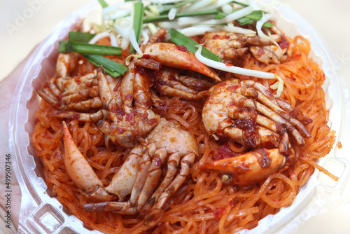 Fried noodle with crabs in Chanthaburi province style (Pad Thai in Thai language). One of the popular seafoods menu in street foods of Thailand.   © Charlie Waradee