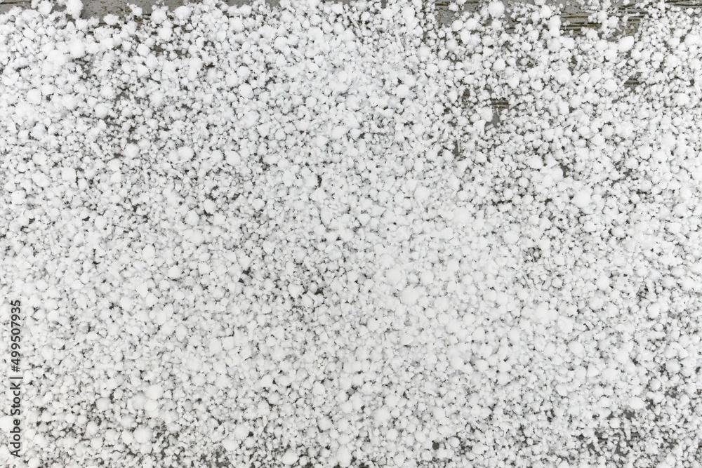 Full Frame Flatlay of A Thin Fresh Layer of Graupel Snow