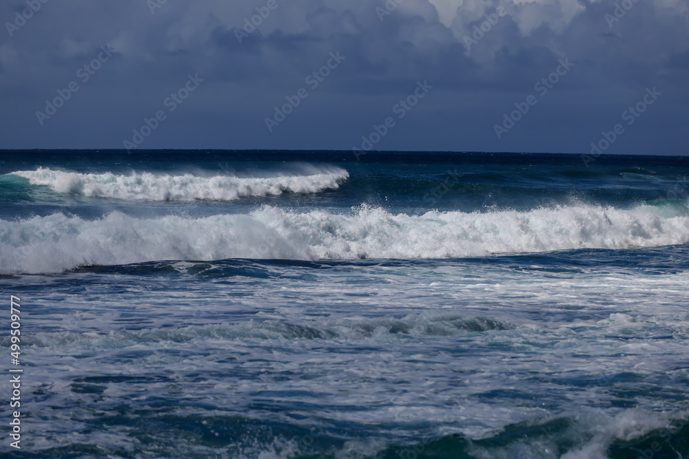 Waves crashing along Sunset Beach on Oahu