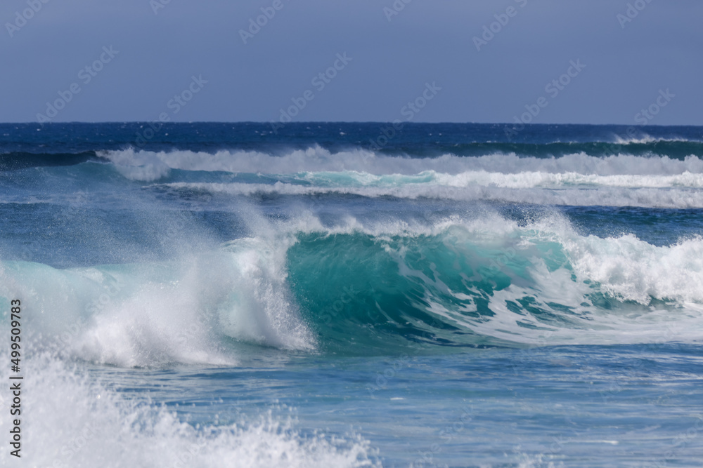 Waves crashing along Sunset Beach on Oahu