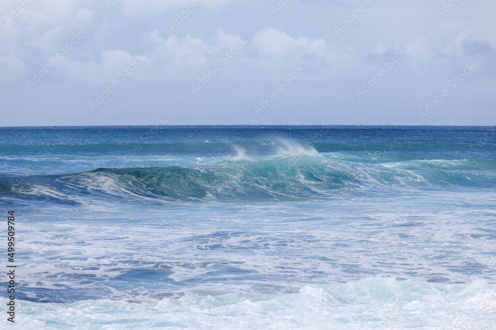 Waves crashing along Sunset Beach on Oahu