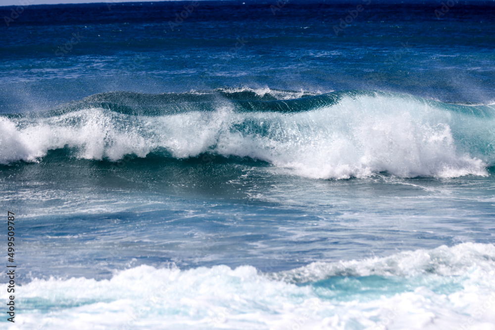 Waves crashing along Sunset Beach on Oahu