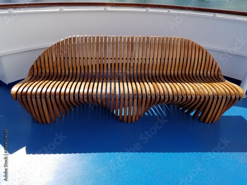 Foto Wooden bench on cruise ship deck