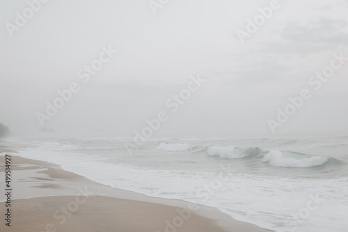 Seascape abstract beach background with misty. sea surf with fog. Image soft look with smooth technique.