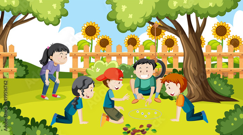 Children playing jack stones at the park