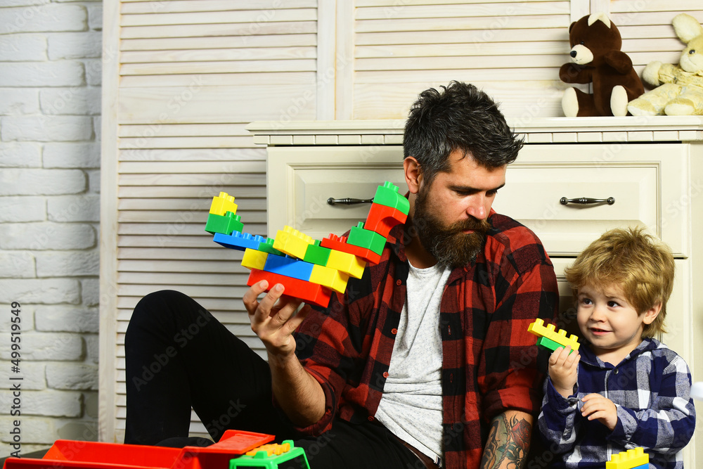 Bricks Father Loving dad and little boy child have fun play build construct with ...