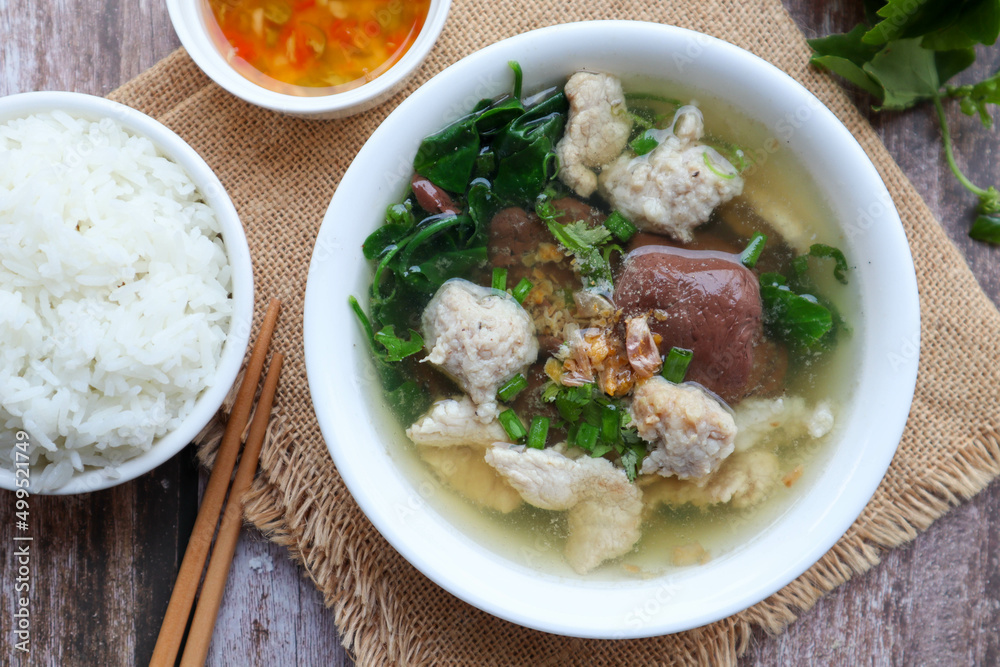 Thai Style clear soup of pork blood, pork and minced pork ( Thai- Chinese famous breakfast called Tom Lued Moo at top view ) Thai Style clear soup of pork blood, pork and minced pork ( Thai- Chinese famous breakfast called Tom Lued Moo at top view )
