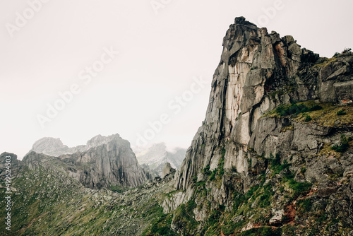 Detail of a mountain rock face. Huge rock wall of granite in Ergaki, Russia. High rocky moutain walls.
