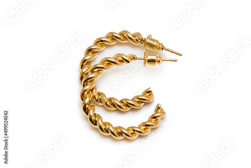 Gold earrings on a white background