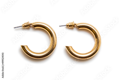 Gold earrings on a white background