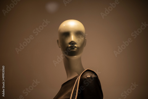 Face of mannequin. Mannequin on uniform background. Girl with bald head. Elegance is all rage.
