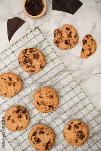 Freshly baked cookies or chocolate chip cookies on a wire cooling rack